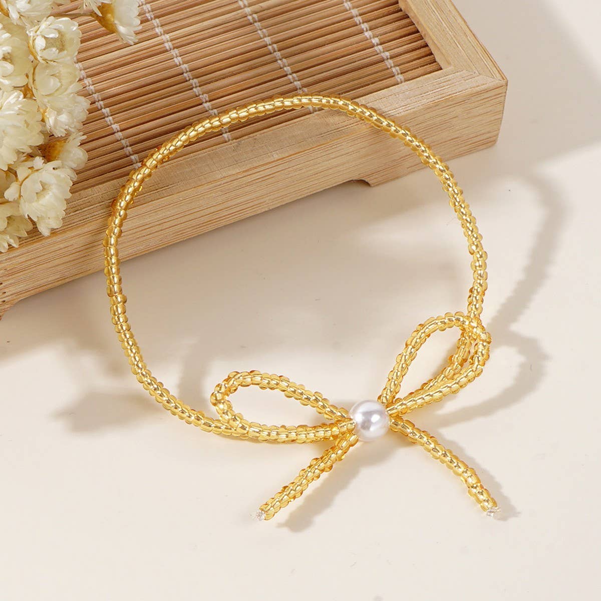 Delicate Millet Beaded Bow Bracelet