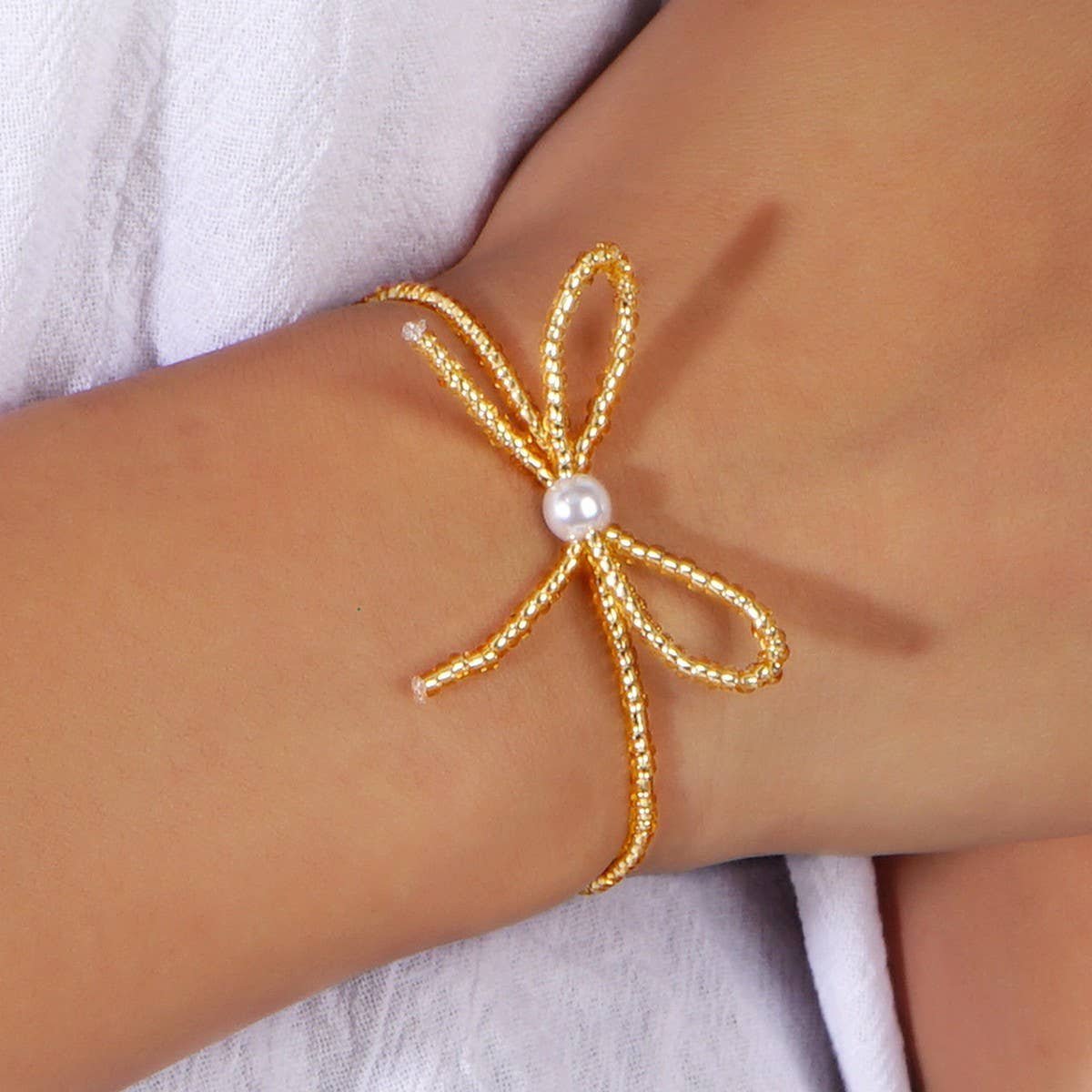Delicate Millet Beaded Bow Bracelet