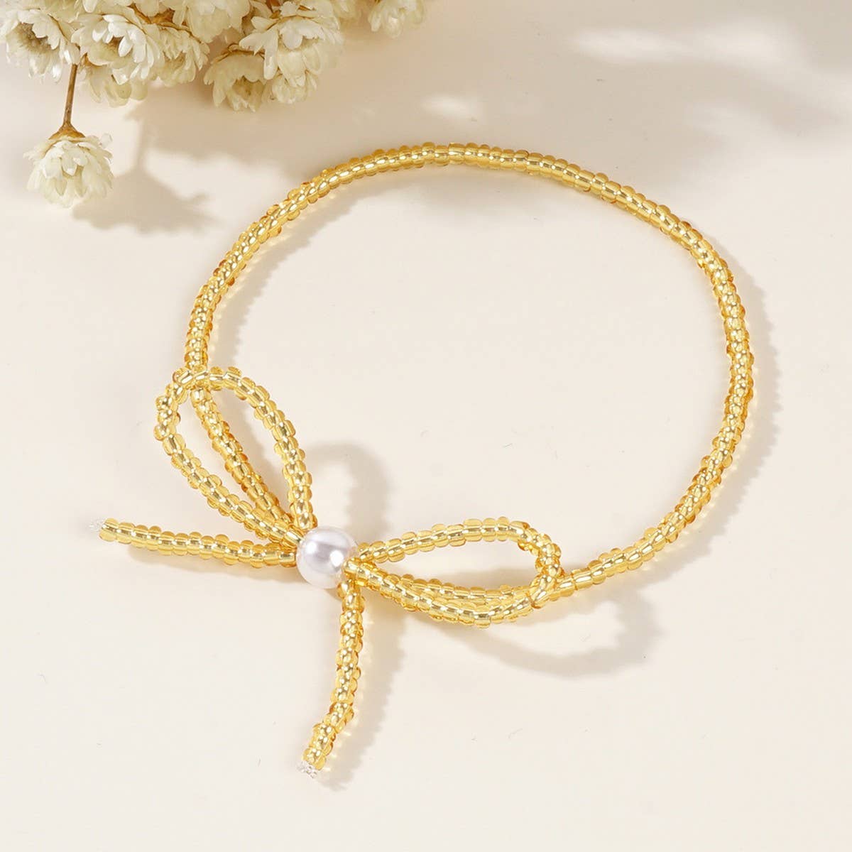 Delicate Millet Beaded Bow Bracelet